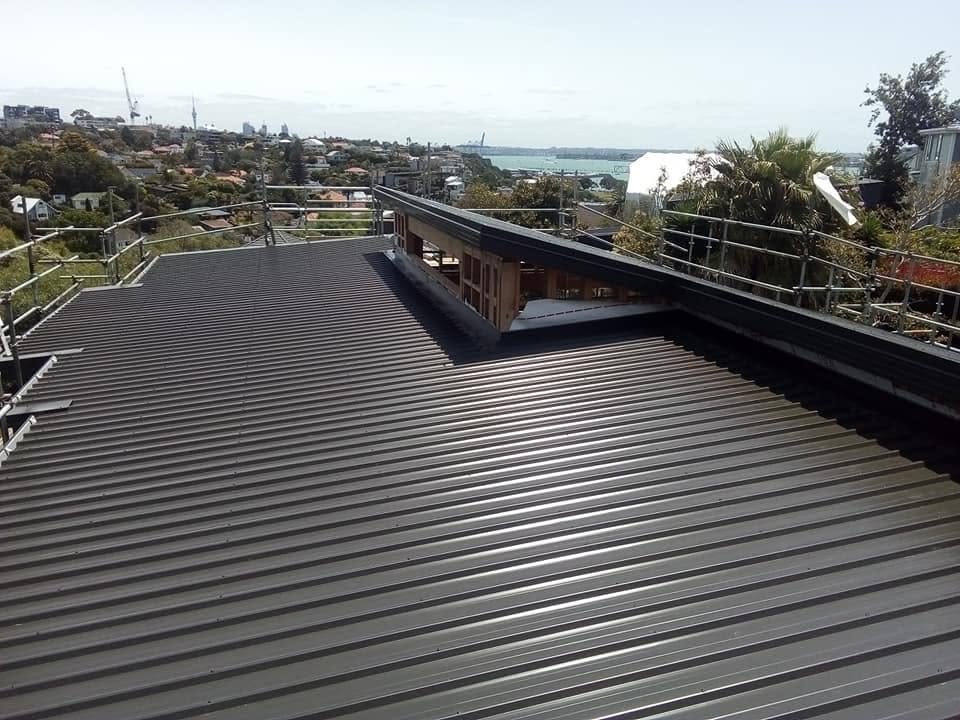 Dark long-run roof overlooking the Auckland harbour and skyline